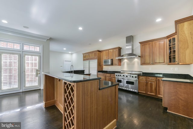 1496 Evans Farm Dr, Mclean, VA 22101 - kitchen with wall chimney exhaust hood, high end appliances, dark wood finished floors, an island with sink, and glass insert cabinets