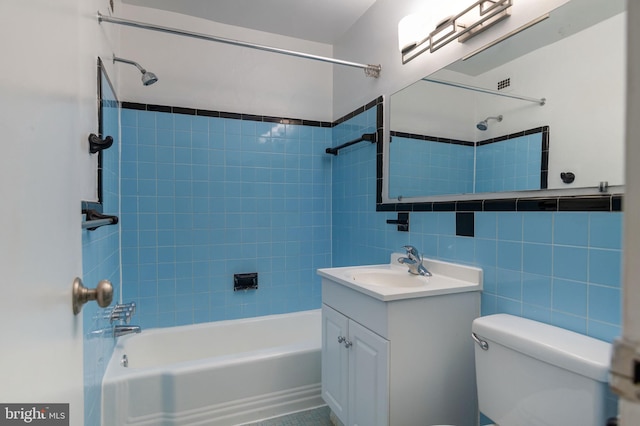 1200 S Arlington Ridge Rd Unit 205, Arlington, VA 22202 - bathroom with tub / shower combination, vanity, toilet, and tile walls
