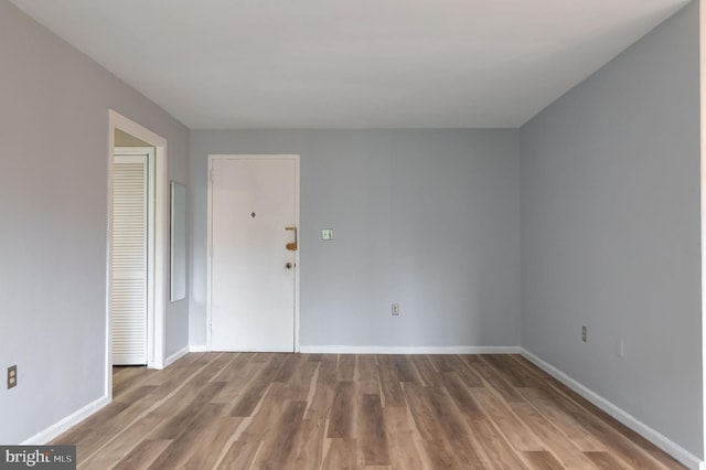 1200 S Arlington Ridge Rd Unit 205, Arlington, VA 22202 - spare room featuring wood finished floors and baseboards