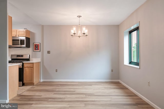 1200 S Arlington Ridge Rd Unit 205, Arlington, VA 22202 - unfurnished dining area featuring light wood finished floors, a chandelier, and baseboards