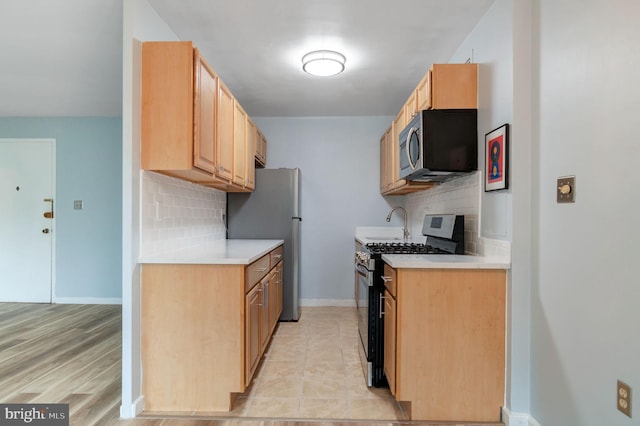 1200 S Arlington Ridge Rd Unit 205, Arlington, VA 22202 - kitchen with stainless steel appliances, tasteful backsplash, and light countertops