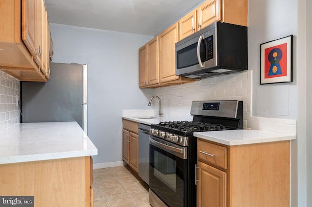 1200 S Arlington Ridge Rd Unit 205, Arlington, VA 22202 - kitchen featuring appliances with stainless steel finishes, tasteful backsplash, a sink, light countertops, and light tile patterned floors