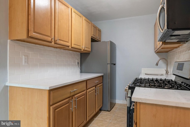 1200 S Arlington Ridge Rd Unit 205, Arlington, VA 22202 - kitchen with stainless steel appliances, tasteful backsplash, and light tile patterned floors