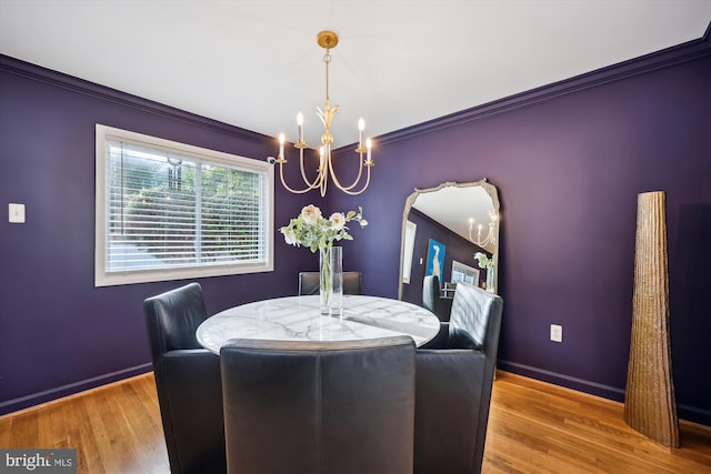 11700 Seven Locks Rd, Potomac, MD 20854 - dining space with a chandelier, ornamental molding, wood finished floors, and baseboards