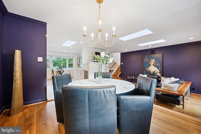 11700 Seven Locks Rd, Potomac, MD 20854 - dining area with a skylight, stairway, light wood-style floors, and a chandelier