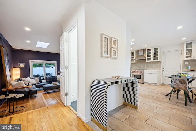11700 Seven Locks Rd, Potomac, MD 20854 - corridor with a skylight, recessed lighting, and light wood-style floors