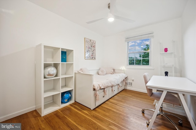 11700 Seven Locks Rd, Potomac, MD 20854 - bedroom with an office area, wood finished floors, baseboards, and a ceiling fan