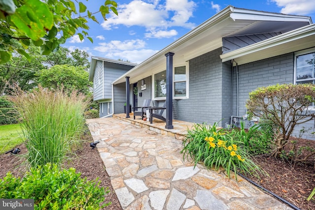 11700 Seven Locks Rd, Potomac, MD 20854 - view of exterior entry with covered porch and brick siding