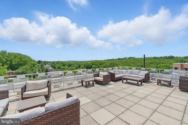 4000 Tunlaw Rd NW Unit 714, Washington, DC 20007 - view of patio featuring an outdoor living space and a view of trees