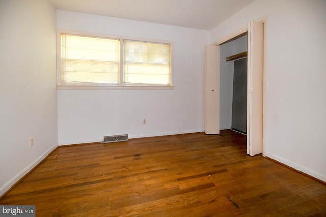 21749 Point Lookout Rd, Leonardtown, MD 20650 - unfurnished bedroom featuring multiple windows, wood finished floors, and baseboards