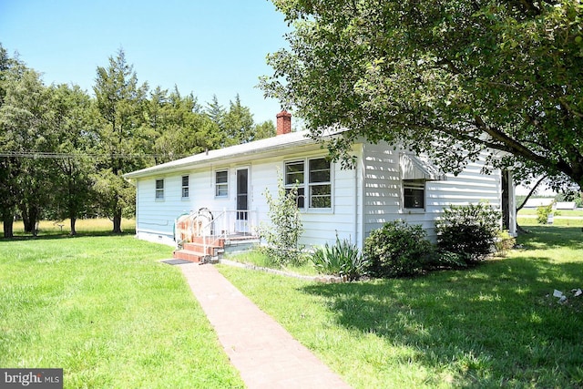 21749 Point Lookout Rd, Leonardtown, MD 20650 - view of front of property featuring a front yard and a chimney