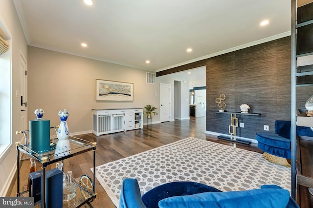 24824 Scarlet Maple Ct, Aldie, VA 20105 - living area featuring ornamental molding, wood finished floors, baseboards, recessed lighting, and an accent wall