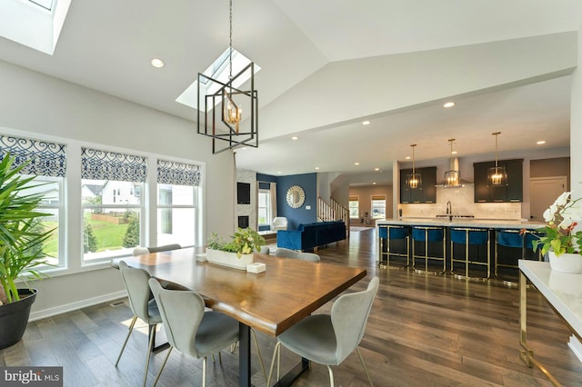 24824 Scarlet Maple Ct, Aldie, VA 20105 - dining room with plenty of natural light, a skylight, dark wood-style flooring, recessed lighting, and high vaulted ceiling