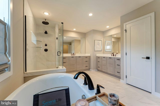24824 Scarlet Maple Ct, Aldie, VA 20105 - full bath with a stall shower, marble finish flooring, a tub to relax in, two vanities, and recessed lighting