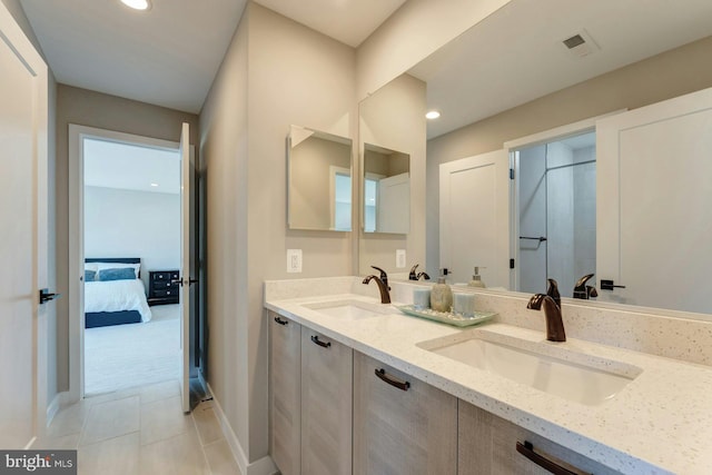 24824 Scarlet Maple Ct, Aldie, VA 20105 - full bath with double vanity, ensuite bath, recessed lighting, tile patterned floors, and baseboards