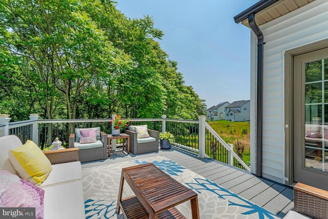 24824 Scarlet Maple Ct, Aldie, VA 20105 - wooden deck with an outdoor hangout area