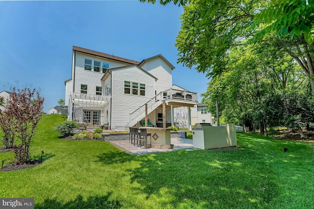 24824 Scarlet Maple Ct, Aldie, VA 20105 - back of house featuring a lawn, a patio, a wooden deck, and french doors