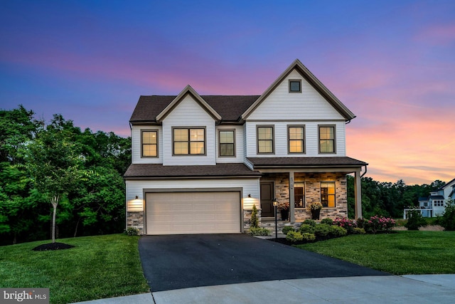 24824 Scarlet Maple Ct, Aldie, VA 20105 - view of front of house with asphalt driveway, a porch, a yard, and a garage