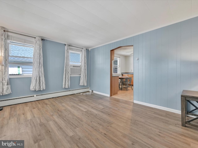 415 Parkway Ave, Schuylkill Haven, PA 17972 - unfurnished room with arched walkways, a baseboard heating unit, wood finished floors, baseboards, and ornamental molding