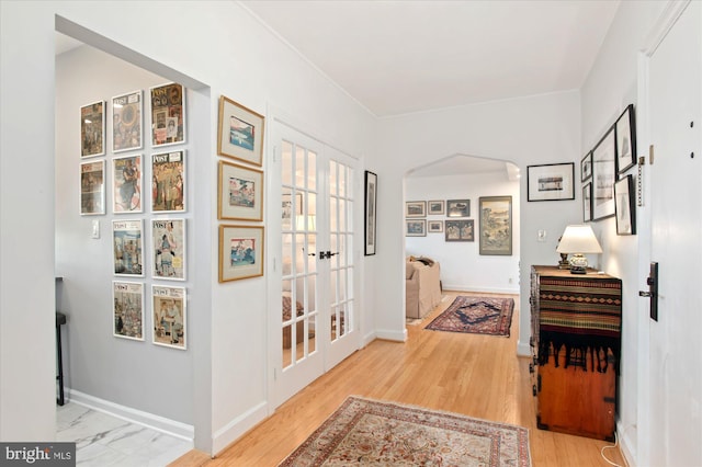 3601 Connecticut Ave NW Unit 816, Washington, DC 20008 - hallway featuring arched walkways, french doors, and wood finished floors