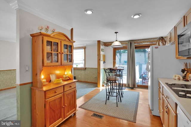 108 Kennedy Blvd, Bellmawr, NJ 08031 - kitchen featuring black electric cooktop, light countertops, crown molding, pendant lighting, and light wood-style flooring