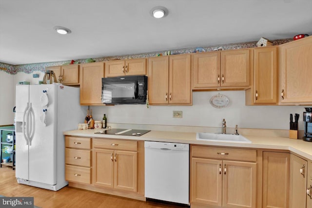 108 Kennedy Blvd, Bellmawr, NJ 08031 - kitchen with black appliances, light brown cabinets, light wood-type flooring, and light countertops