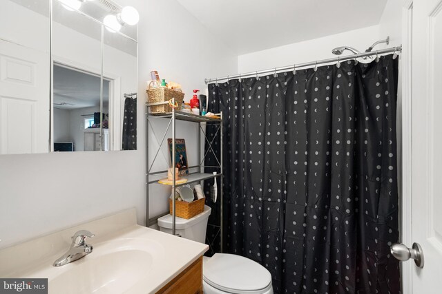 519 Thomas, Little Egg Harbor Twp, NJ 08087 - bathroom featuring toilet, vanity, and a shower with shower curtain