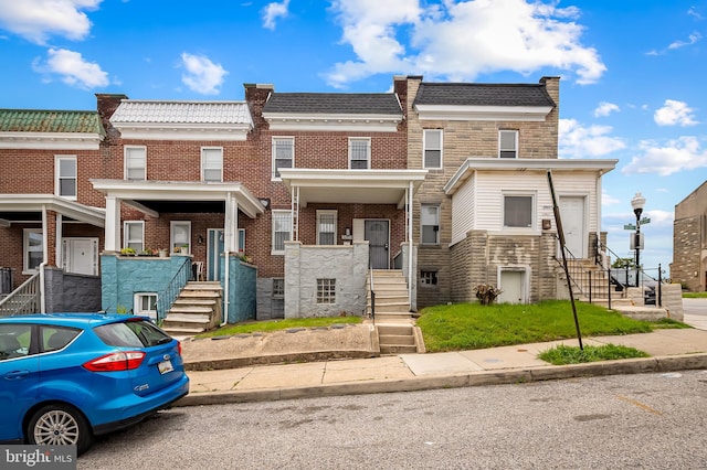 3003 Kentucky Ave, Baltimore, MD 21213 - view of property with brick siding, mansard roof, and stairs