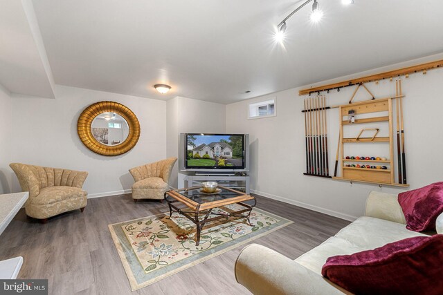 1399 N Royal Ave, Front Royal, VA 22630 - living area featuring wood finished floors, baseboards, and track lighting