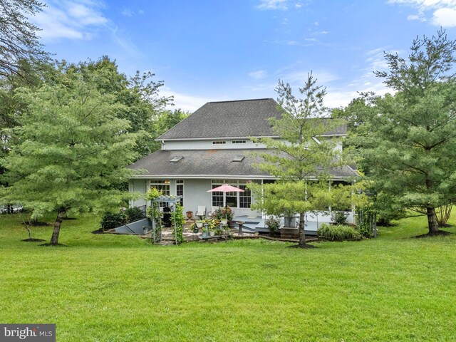 1399 N Royal Ave, Front Royal, VA 22630 - rear view of house with a patio, a lawn, and a shingled roof