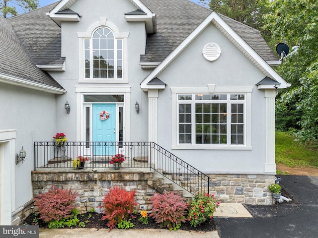 1399 N Royal Ave, Front Royal, VA 22630 - view of front facade with a shingled roof and stucco siding
