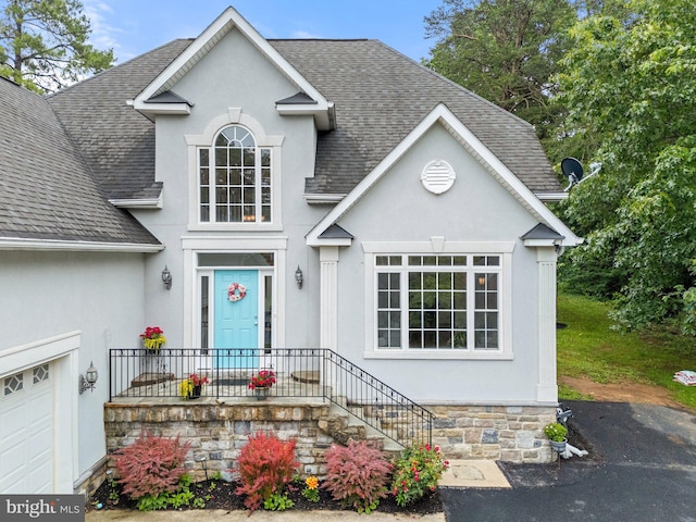 1399 N Royal Ave, Front Royal, VA 22630 - view of front of home featuring a shingled roof, stucco siding, and stone siding