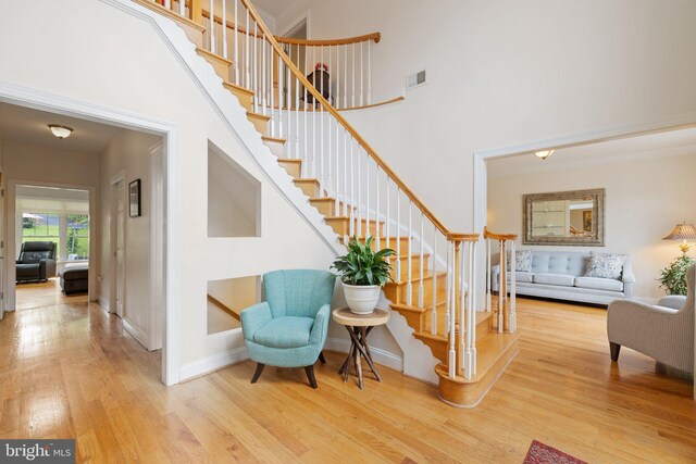 1399 N Royal Ave, Front Royal, VA 22630 - stairway featuring wood finished floors, a high ceiling, and baseboards