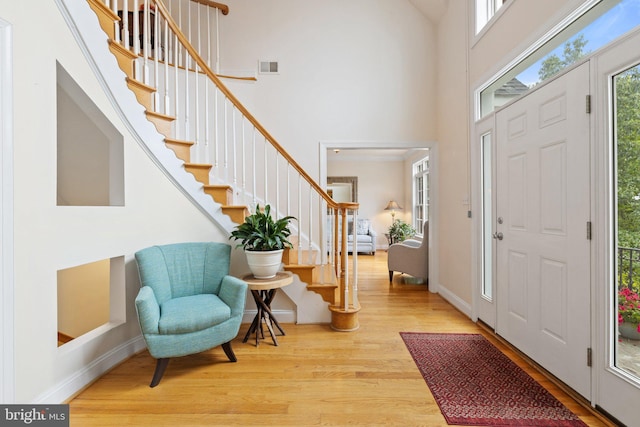 1399 N Royal Ave, Front Royal, VA 22630 - entrance foyer with wood finished floors, a towering ceiling, stairway, and baseboards