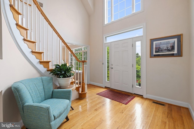 1399 N Royal Ave, Front Royal, VA 22630 - foyer entrance with a towering ceiling, baseboards, stairs, and wood finished floors