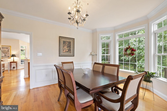 1399 N Royal Ave, Front Royal, VA 22630 - dining space featuring a chandelier, light wood-style flooring, a wainscoted wall, and ornamental molding