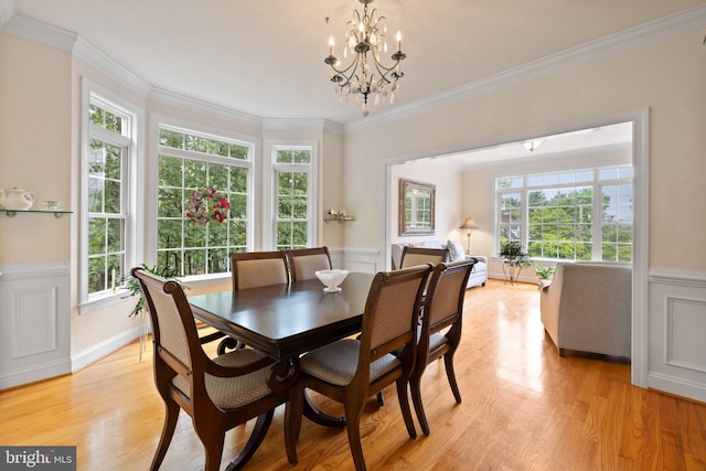 1399 N Royal Ave, Front Royal, VA 22630 - dining room with light wood finished floors, crown molding, a chandelier, and wainscoting