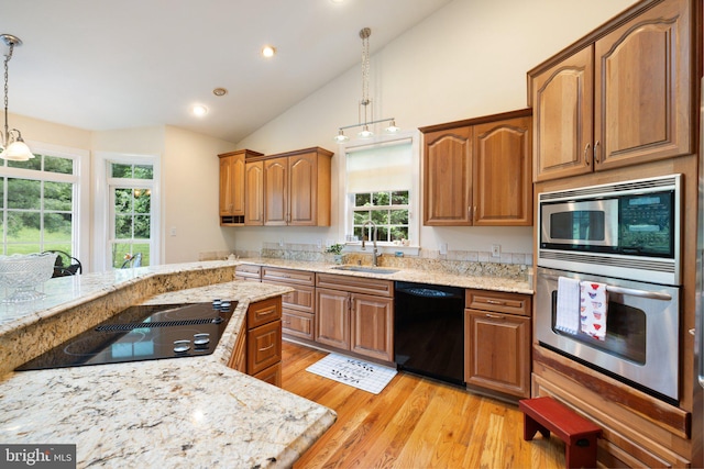 1399 N Royal Ave, Front Royal, VA 22630 - kitchen with black appliances, a sink, light wood-style flooring, vaulted ceiling, and recessed lighting