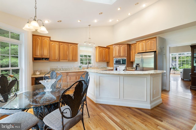 1399 N Royal Ave, Front Royal, VA 22630 - kitchen featuring appliances with stainless steel finishes, a kitchen island, light wood-style floors, healthy amount of natural light, and recessed lighting