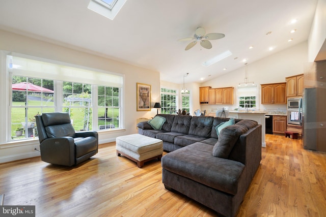 1399 N Royal Ave, Front Royal, VA 22630 - living room featuring a skylight, light wood finished floors, vaulted ceiling, ceiling fan, and recessed lighting