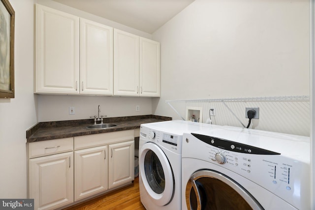 1399 N Royal Ave, Front Royal, VA 22630 - washroom featuring washer and clothes dryer, cabinet space, bar with sink, and light wood-style flooring