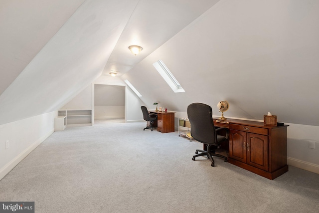 1399 N Royal Ave, Front Royal, VA 22630 - office with vaulted ceiling, a skylight, light colored carpet, and baseboards