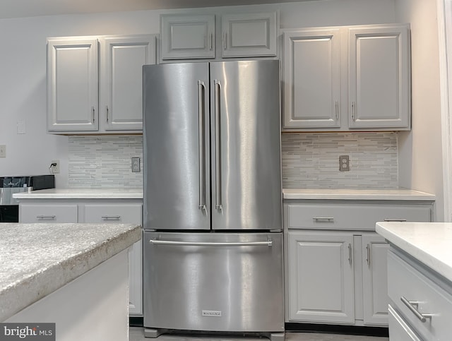 41920 Clover Hill Ct, Hollywood, MD 20636 - kitchen with high end fridge, backsplash, and white cabinetry