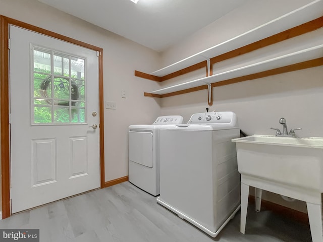 41920 Clover Hill Ct, Hollywood, MD 20636 - laundry area featuring washing machine and clothes dryer and light wood-type flooring