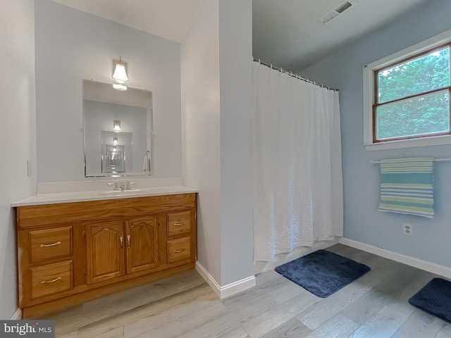 41920 Clover Hill Ct, Hollywood, MD 20636 - full bath with wood finished floors, vanity, curtained shower, and baseboards