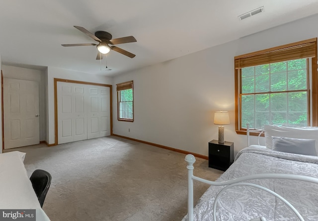 41920 Clover Hill Ct, Hollywood, MD 20636 - bedroom featuring baseboards, light carpet, a closet, and a ceiling fan