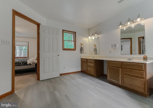 41920 Clover Hill Ct, Hollywood, MD 20636 - full bathroom featuring double vanity, wood finished floors, connected bathroom, and baseboards