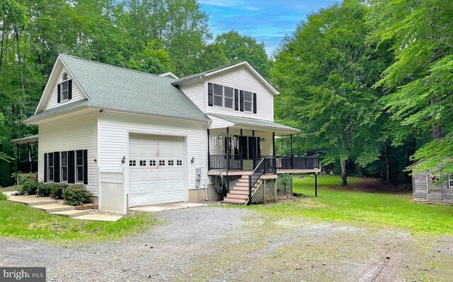 41920 Clover Hill Ct, Hollywood, MD 20636 - view of front facade with covered porch, driveway, a garage, a shingled roof, and stairway