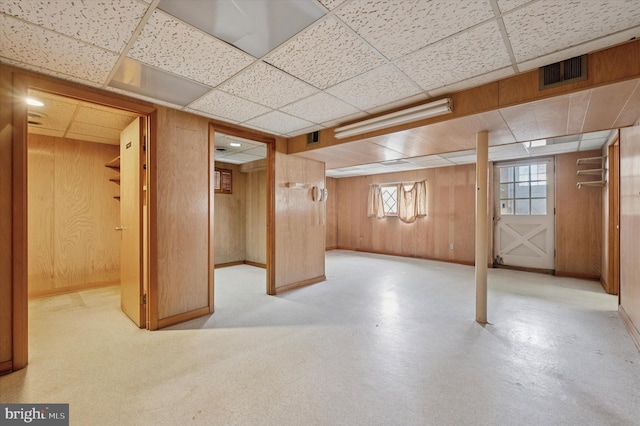 167 Eldon Ave, Lansdowne, PA 19050 - basement with a drop ceiling, wooden walls, and baseboards