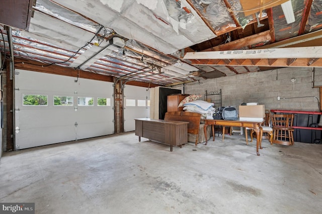 167 Eldon Ave, Lansdowne, PA 19050 - garage featuring concrete block wall and a garage door opener
